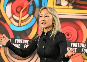 Sarah Guo speaking at a venture capital and AI conference
