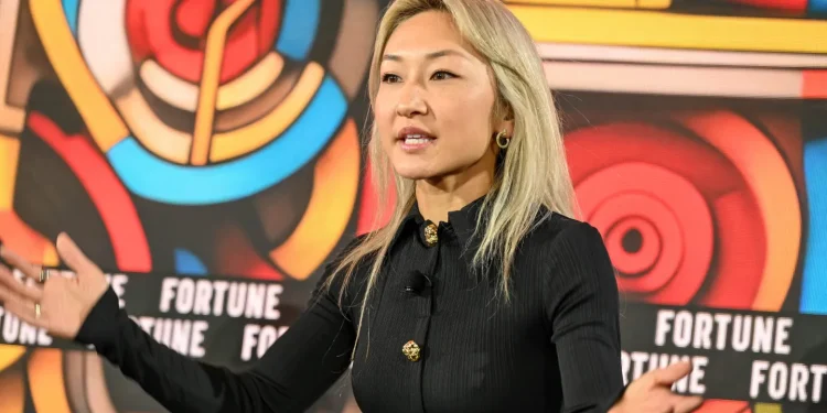 Sarah Guo speaking at a venture capital and AI conference