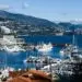 Breathtaking view of Monaco marina with luxurious yachts and scenic backdrop.