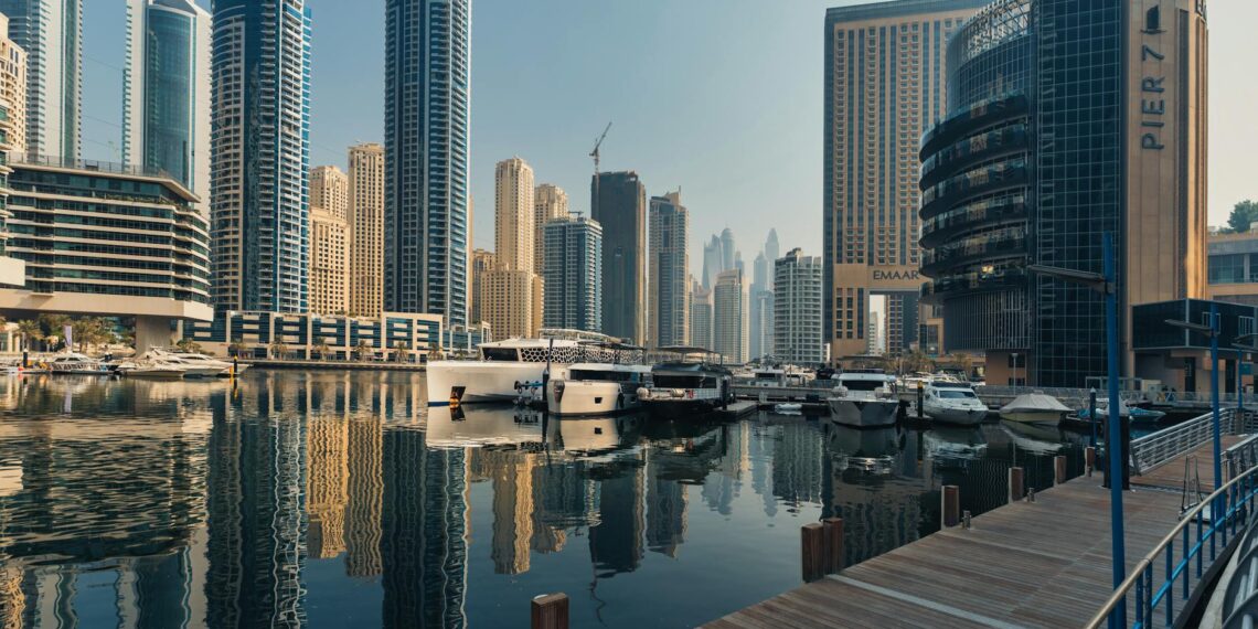 Explore the breathtaking skyline of Dubai Marina with iconic skyscrapers and luxury yachts.
