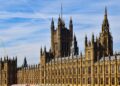 Second Passport Application UK: Requirements and the 2026 Entry Rule — Stunning view of the historic Palace of Westminster in London under a clear blue sky.