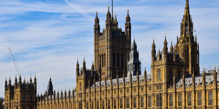 Second Passport Application UK: Requirements and the 2026 Entry Rule — Stunning view of the historic Palace of Westminster in London under a clear blue sky.