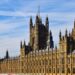 Second Passport Application UK: Requirements and the 2026 Entry Rule — Stunning view of the historic Palace of Westminster in London under a clear blue sky.
