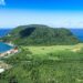Cheapest Citizenship by Investment 2026: Dominica and Caribbean Comparison — Stunning aerial view of a tropical island surrounded by the azure Caribbean Sea. Perfect for travel imagery.