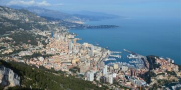 Where to hold crypto without paying capital gains: seven jurisdictions — Breathtaking aerial view of Monaco with its vibrant cityscape, coastline, and harbor.