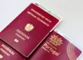 EU Citizenship by Investment: What Ended, What Remains in 2026 — A close-up image of Austrian and Portuguese passports with a Bulgarian ID card.