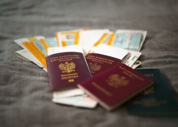 How to Apply for a Second UK Passport Online — Close-up of Polish passports and travel tickets symbolizing travel and adventure.