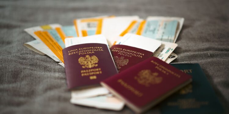 How to Apply for a Second UK Passport Online — Close-up of Polish passports and travel tickets symbolizing travel and adventure.