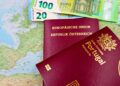 Golden Visa EU: Complete 2026 Comparison of Active Investment Routes — Austrian and Portuguese passports on a European map with euro banknotes.