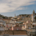 Portugal Citizenship by Investment: 2026 Rules, Timeline & Investor Backlash — Aerial view of Lisbon's charming historic architecture under a bright sky.
