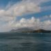 St. Kitts Citizenship by Investment: Complete 2026 Guide — A picturesque Caribbean seascape featuring luxury yachts, ocean, hills, and a vibrant sky.