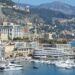 How to Become a Monaco Tax Resident: Complete 2025 Guide — A stunning view of Monaco's harbor, cityscape, and yachts docked under a clear sky.
