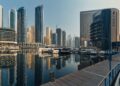 Explore the breathtaking skyline of Dubai Marina with iconic skyscrapers and luxury yachts.
