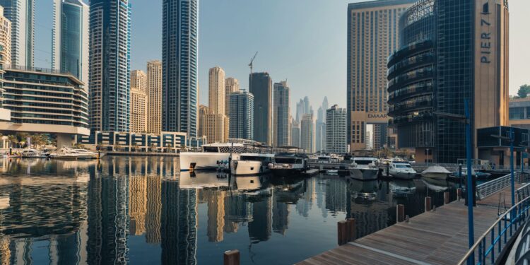 Explore the breathtaking skyline of Dubai Marina with iconic skyscrapers and luxury yachts.