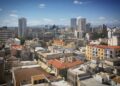 Cyprus Golden Visa: Investment Options, Costs & Application Timeline — Skyline view of Nicosia's diverse architecture under a clear blue sky.