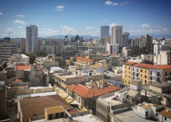Cyprus Golden Visa: Investment Options, Costs & Application Timeline — Skyline view of Nicosia's diverse architecture under a clear blue sky.