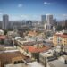 Cyprus Golden Visa: Investment Options, Costs & Application Timeline — Skyline view of Nicosia's diverse architecture under a clear blue sky.