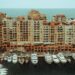 Tax-Free Countries in Europe: Monaco, Gibraltar and Territorial Rules — A stunning aerial photo showcasing luxury yachts moored at a waterfront with apartment buildings in Monaco.