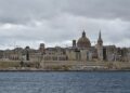 Malta Citizenship by Investment: Why the Programme Ended in 2025 — The iconic skyline of Valletta, Malta featuring St. Paul's Cathedral under a moody sky.
