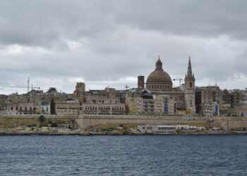 Malta Citizenship by Investment: Why the Programme Ended in 2025 — The iconic skyline of Valletta, Malta featuring St. Paul's Cathedral under a moody sky.