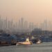Tax-Free Countries in the World: Where Personal Income Tax Is Zero — Dubai Marina with luxury yachts against a skyline of iconic skyscrapers in the morning light.