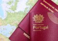 Why the Cheapest Citizenship by Investment Programmes Are Often the Worst Deal — Close-up of Portuguese and Austrian passports lying on a map of Europe, symbolizing travel and mobility.