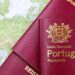 Why the Cheapest Citizenship by Investment Programmes Are Often the Worst Deal — Close-up of Portuguese and Austrian passports lying on a map of Europe, symbolizing travel and mobility.