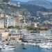 How to Become a Monaco Tax Resident: Complete 2025 Guide — A stunning view of Monaco's harbor, cityscape, and yachts docked under a clear sky.
