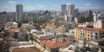 Cyprus Golden Visa: Investment Options, Costs & Application Timeline — Skyline view of Nicosia's diverse architecture under a clear blue sky.