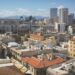 Cyprus Golden Visa: Investment Options, Costs & Application Timeline — Skyline view of Nicosia's diverse architecture under a clear blue sky.