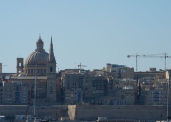 Citizenship by Investment Malta: What Ended and What Remains in 2026 — Beautiful view of Valletta with boats in foreground, highlighting iconic architecture under a clear blue sky.