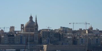 Citizenship by Investment Malta: What Ended and What Remains in 2026 — Beautiful view of Valletta with boats in foreground, highlighting iconic architecture under a clear blue sky.