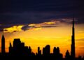 Dubai Golden Visa: Official Investment Minimums and Application Routes — Captivating silhouette of Dubai's skyline with vibrant sunset colors and Burj Khalifa dominating the scene.