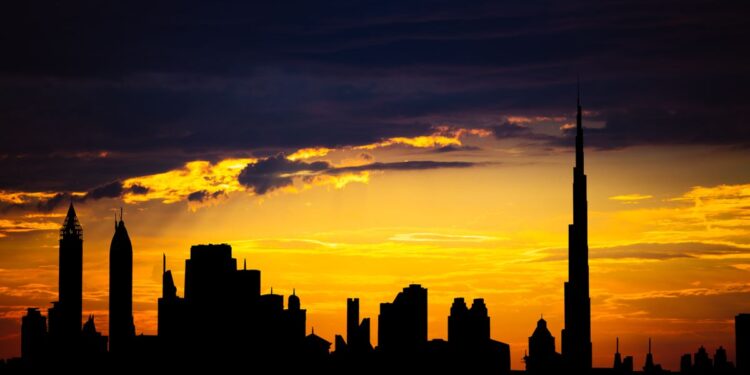 Dubai Golden Visa: Official Investment Minimums and Application Routes — Captivating silhouette of Dubai's skyline with vibrant sunset colors and Burj Khalifa dominating the scene.