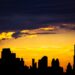 Dubai Golden Visa: Official Investment Minimums and Application Routes — Captivating silhouette of Dubai's skyline with vibrant sunset colors and Burj Khalifa dominating the scene.