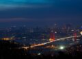 Turkish Citizenship by Investment: The $400,000 Route to a Second Passport — Illuminated Bosphorus Bridge and Istanbul cityscape captured at night creating a breathtaking urban scene.