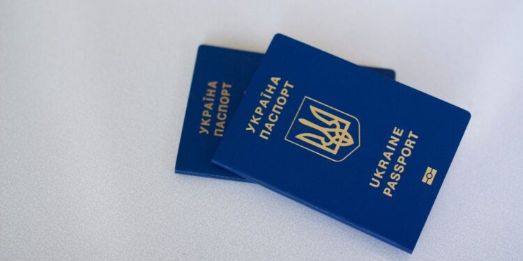 Golden Visa Requirements: Complete 2026 Eligibility Guide — Image of two Ukrainian passports on a white surface, highlighting travel and identification themes.
