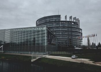 European Union institutional building representing demographic and fiscal policy challenges