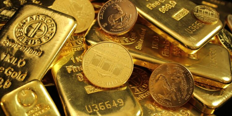 Stacked gold bars in secure vault storage facility