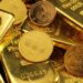 Stacked gold bars in secure vault storage facility