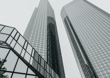 Modern city skyline with office buildings, representing global wealth and financial centres