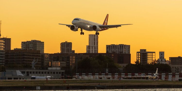 Aircraft over a city skyline, illustrating wealth migration