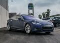 Tesla dealership storefront in California showing electric vehicles on display