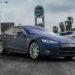 Tesla dealership storefront in California showing electric vehicles on display