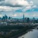 Aerial view of the City of London skyline and the River Thames, illustrating millionaires leaving the UK